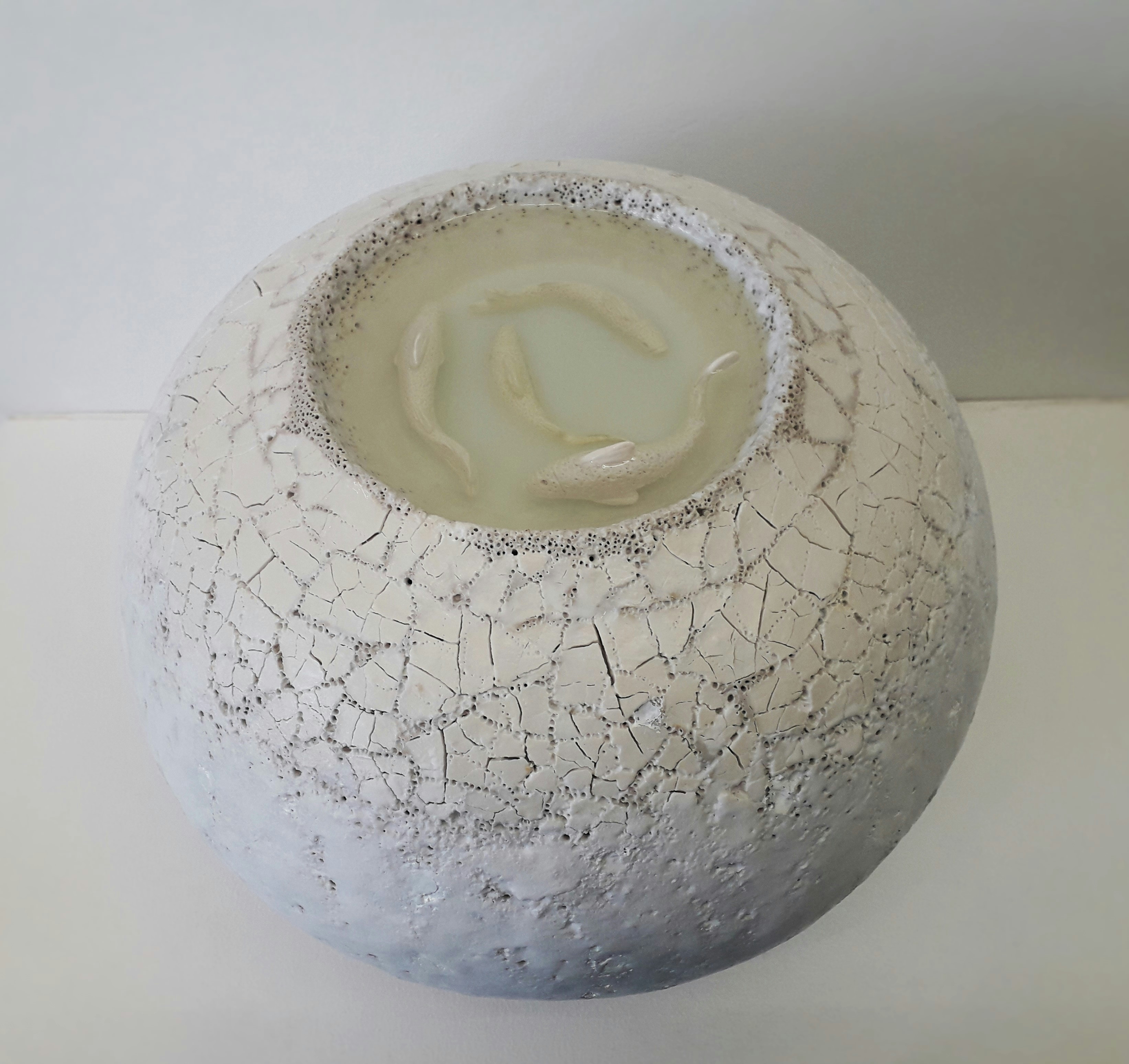 "White fishes", ceramic sculpture like a big snowball with glacier water, cracked ice (porcelain mosaik)